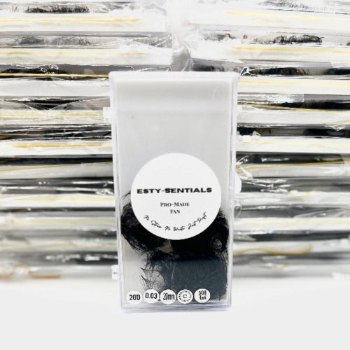 Packaged product with 'ESTY-SENTIALS' label in front of stacked packages.